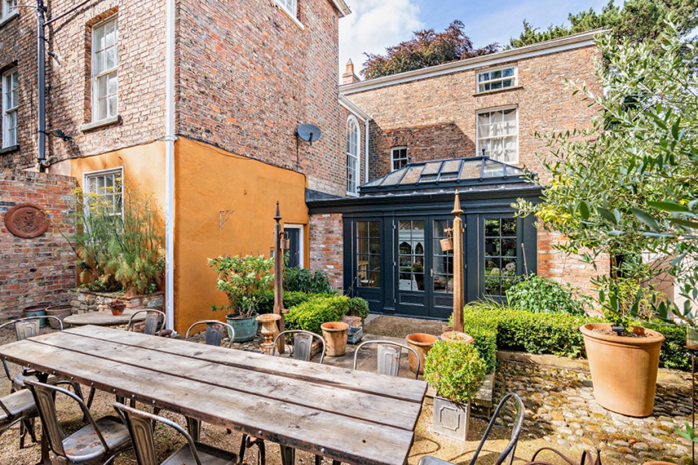 Patio are with large seating area, rear view to house 